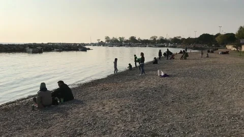 People walking on the beach Stock Footage 144337635