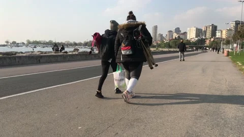 People walking on the beach Stock Footage 144341533