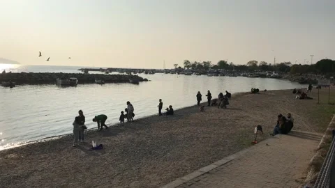 People walking on the beach Stock Footage 144343063