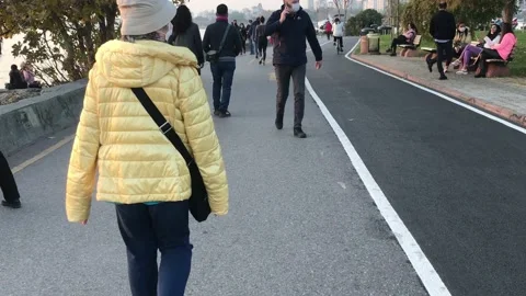 People walking on the beach Stock Footage 144343153