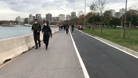 People walking on the beach Stock Footage 144816133