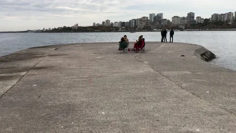 People walking on the beach Stock Footage 144817859