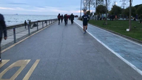 People walking on the beach Stock Footage 144849933