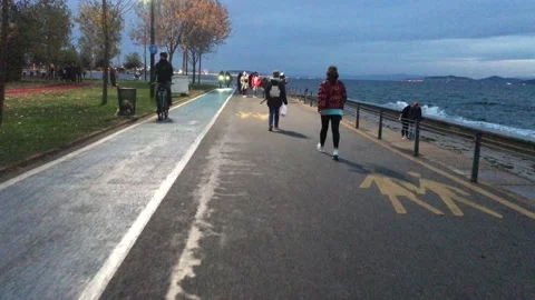People walking on the beach Stock Footage 144850330