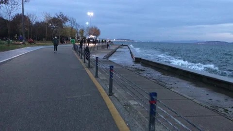 People walking on the beach Stock Footage 144850402