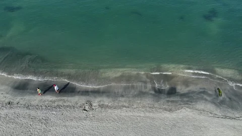 People walking on the beach Stock Footage 243227305