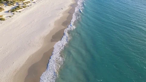 People walking on beach summer flyover aerial footage tourism and travel Stock Footage 99773380