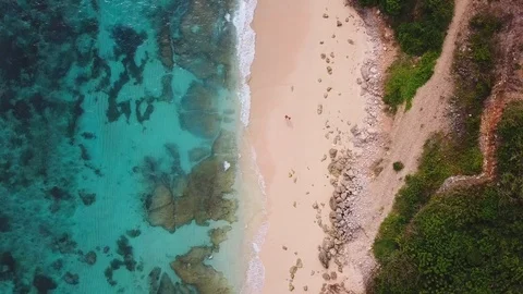 People walking on the beach. View from above - aerial 4k footage Stock Footage 100712223