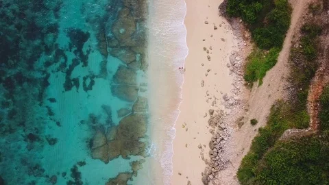 People walking on the beach. View from above - aerial 4k footage Stock Footage 100712241