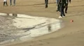 People walking on the beach in winter HD Footage