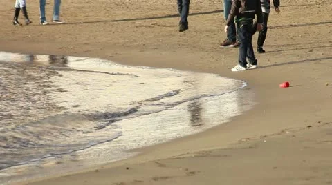 People walking on the beach in winter Stock Footage 10709157