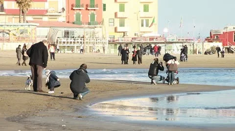 People walking on the beach in winter Stock Footage 10709215