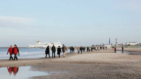People walking on a beach in winter Stock Footage 36783659