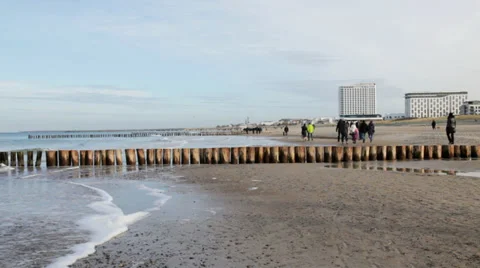 People walking on a beach in winter Stock Footage 36783844