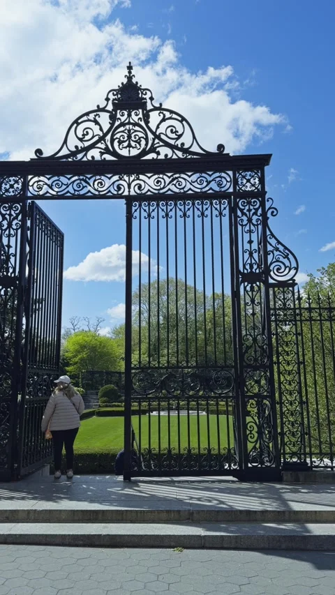 People Walking Beneath Vanderbilt Gate in Central Park Vertical Pan Left Stock Footage 336546448
