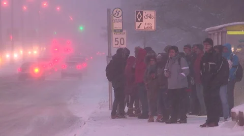 People walking in blizzard snow wind and cold weather in major winter storm Stock Footage 44083716