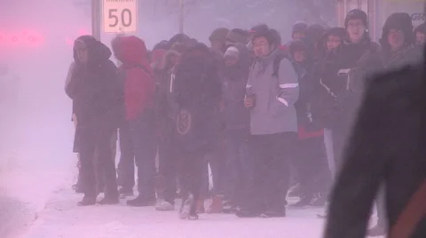 People walking in blizzard snow wind and cold weather in major winter storm Stock Footage 44084310