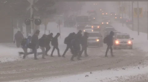People walking in blizzard snow wind and cold weather in major winter storm Stock Footage 44147171