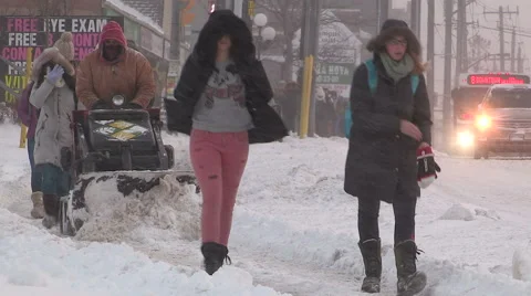 People walking in blizzard snow wind and cold weather in major winter storm Stock Footage 45753825