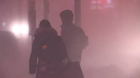 People walking in blizzard snow wind and cold weather in major winter storm Stock Footage 46545775