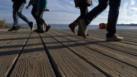 People Walking on Boardwalk at the Beach low angle Stock Footage