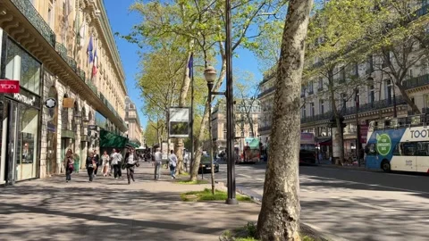 People walking on Boulevard des Capucines in Paris Stock Footage 337783125