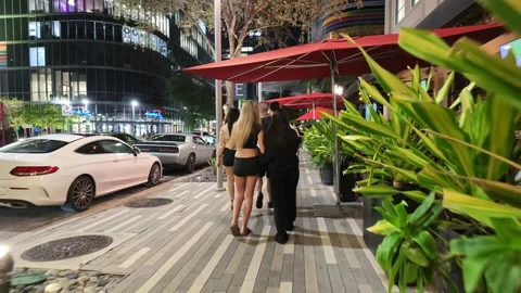 People walking Brickell Miami at night Stock Footage 344976705