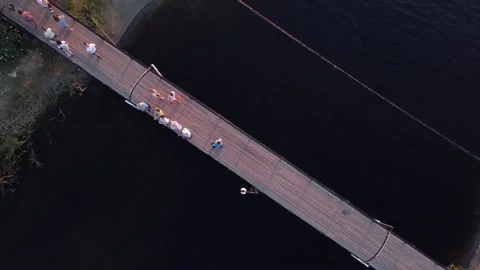 People walking on the bridge over the river. Anapa city August 22, 2021 Video stock 196880659