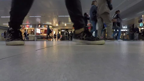People walking by the camera at a Dusseldorf main train station Stock Footage 295432378
