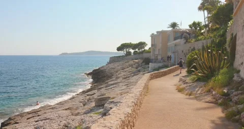 People Walking on Cap d'Ail Coastal Path Beside Mediterranean Sea, French Stock Footage 342935074