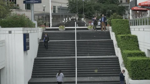 People walking up city steps Stock Footage 126792003