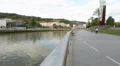 People walking clean river embankment in European city, place for recreation HD Footage