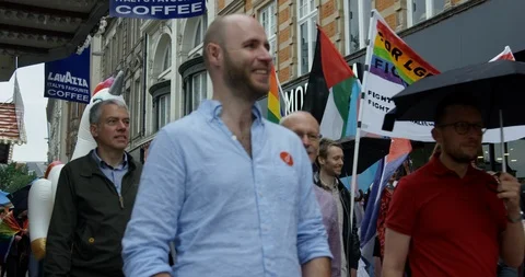 People Walking At Colourful Pride Parade Celebrating LGBTQ Rights In Nottingham Stock Footage 113522083
