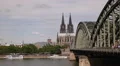 People Walking Crowd Commuters Commuting Cologne Skyline German City Rhine River HD Footage