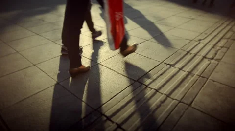 People walking crowd footsteps long shadows silhouettes 3 warm fx Stock Footage 45993959
