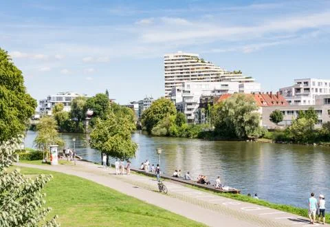 People walking at the Danuber riverfront in Ulm Stock Photos