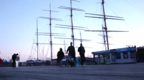 People Walking Dock -- Ship in Background Vídeos de archivo 12517489
