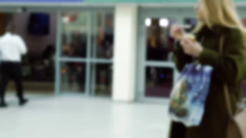 People walking down a corridor in a large room Stock Footage 239626638