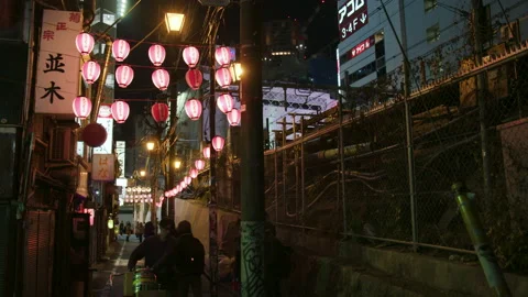 People Walking Down Dark Japaneese Street With Paper Lanterns Stock Footage 239669275