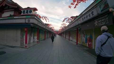 People walking down an empty Nakamise-dori shopping street in Asakusa Stock Footage 330069616