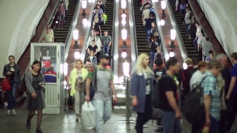 People walking down the escalator in the metro Stock Footage 76481131