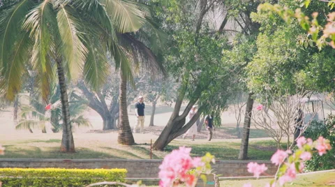 People Walking Down Golf Course 스톡 동영상 61819957