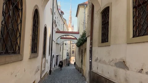 People walking down medieval narrow European street Stock Footage 263484090