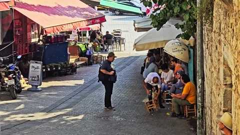 People walking down a narrow. Stock Footage 282680008