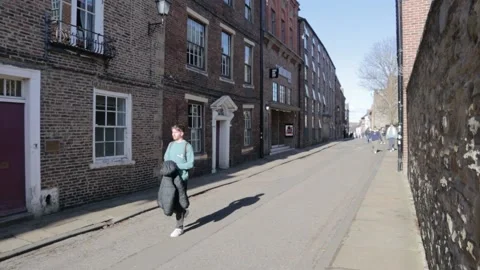 People walking down an old historic pedestrian street. No cars Stock Footage 171862979