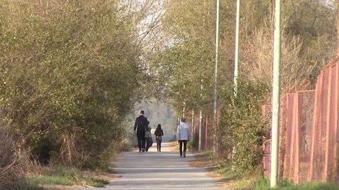 People walking down the pathway | Stock Video | Pond5
