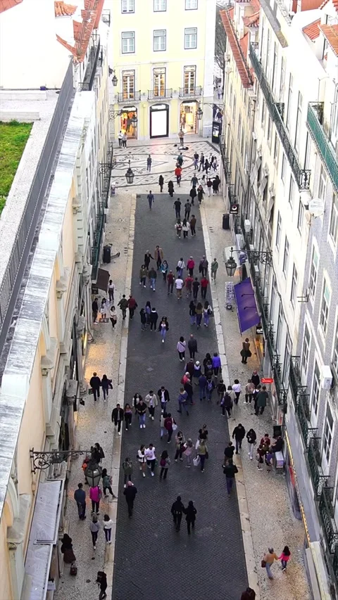 People walking down Rua do Carmo street  looking down from Santa Justa lift Stock Footage 239945025