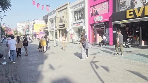 People walking down a sidewalk with a. Stock Footage 282663285