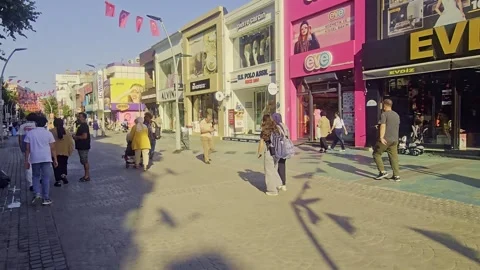 People walking down a sidewalk with a. Stock Footage 284649628