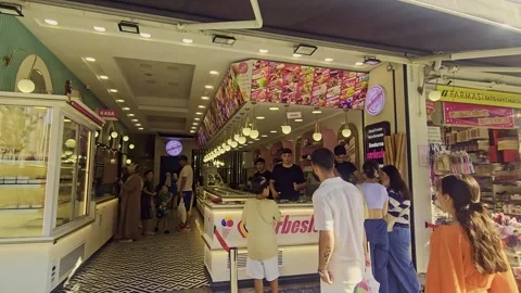 People walking down a sidewalk in front. Video stock 284649180